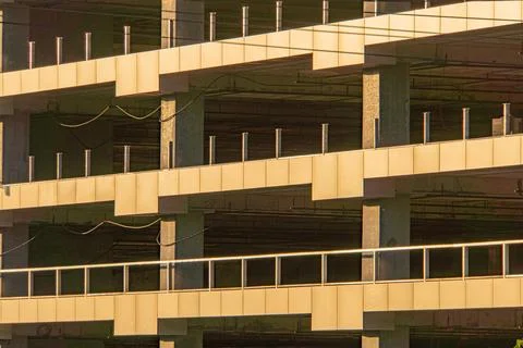 Angular multi-level concrete parking garage, viewed from an angle, showcase.. 스톡 사진