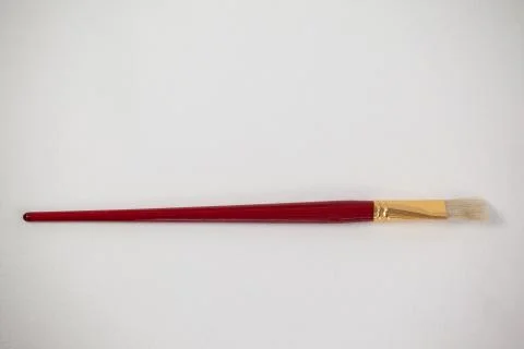 Angular paint brush against white background Stock Photos