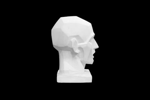 Angular plaster man head isolated on black background. profile view Stock Photos