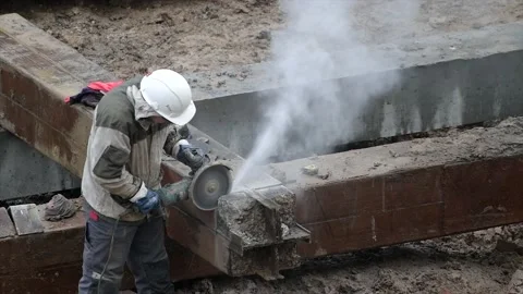 Angular saw grinding through construction piles at construction site. Sharp Stock Footage 205258922