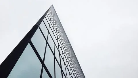 An angular shot of a tall glass facade in Boston. Stock Photos