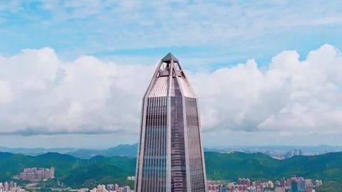 Angular tower summit with distant green hills - Shenzhen Vídeos de archivo 346622556