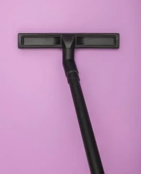 Angular vacuum cleaner hose against a lilac background Stock Photos