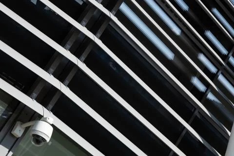 Angular view close-up of dark metal beams structure in fragment of building and Fotos de archivo