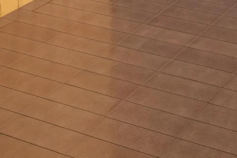 Angular view of light brown color tiled wall Stock Photos