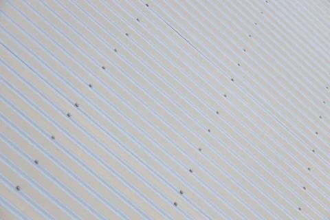 Angular view of metal shiny black corrugated surface Stock Photos
