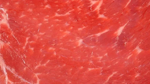 Angus beef steak slow rotating. Meat surface texture. Uncooked fresh beef Stock Footage 121169491