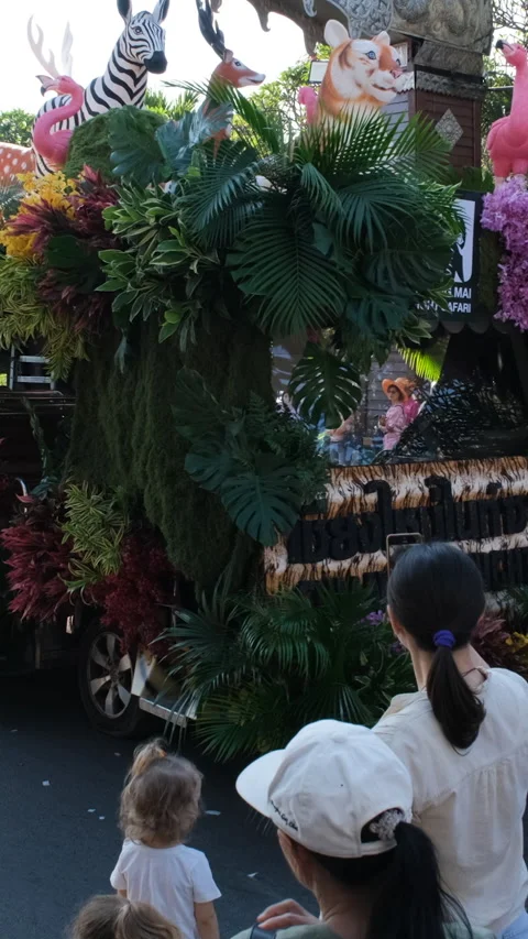 Animal figures on flower float during parade Stock Footage 348715657
