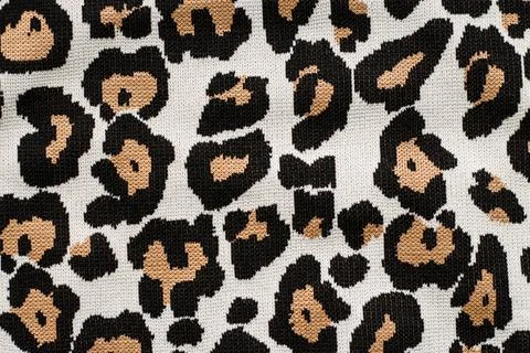 Animal print, leopard pattern fabric background in brown colors Stock Photos