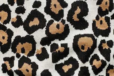 Animal print, leopard pattern fabric background in brown colors Stock Photos