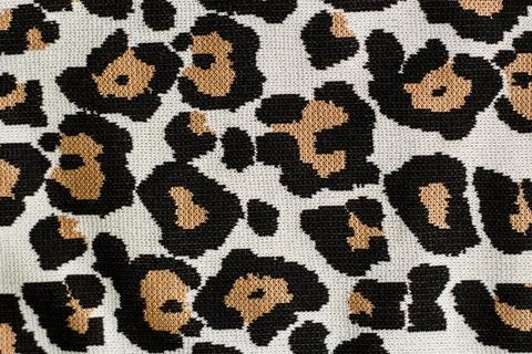 Animal print, leopard pattern fabric background in brown colors Stock Photos