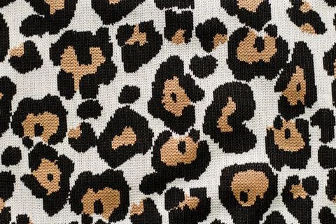 Animal print, leopard pattern fabric background in brown colors Stock Photos