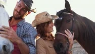 Animals Lovers Couple Taking With Bitless Horses During Sunny Day Stock Footage