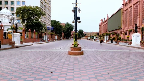 Animals roaming on empty streets of Golden Temple complex, Amritsar during Stock Footage 128440824