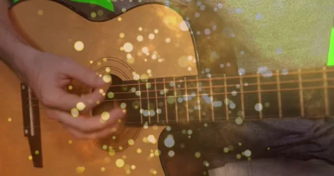 Animated acoustic guitar strings vibrating under strumming hand in close-up, Stock Footage 327450736