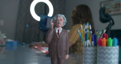 Animated Albert Einstein figurine on The desk of Reading Teacher. 스톡 동영상 155661414