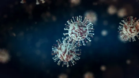 Animated bacteria cells spin together front of blue background, close Video stock 124331480