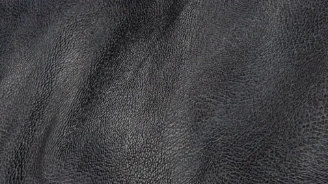 Animated black leather background. a piece of black leather with folds. 3d rende Stock Footage 140296514