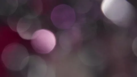 Animated bokeh transition with multi-colored light leaks in the background video Stockbeeldmateriaal 317452907