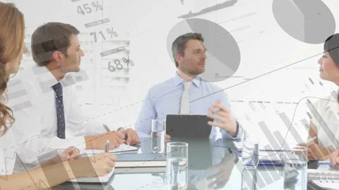 Animated charts appearing over table, leading speaker with tablet addressing Stock Footage 335480822