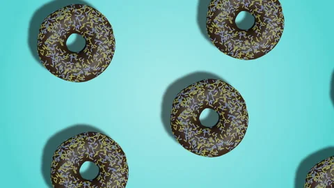 Animated diagonal pattern of chocolate glazed and sprinkled donuts on blue bg Stock Footage 196479280