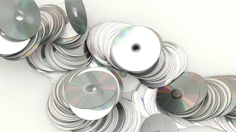Animated falling and bouncing and sliding Blu Ray disks - top view Stock Footage 90967082