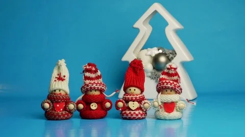 Animated figures in winter wear dancing before Christmas decoration. Stock Footage 83321412