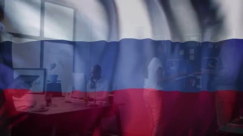 Animated flag overlay waving across camera, revealing office team collaborating Stock Footage 334743723