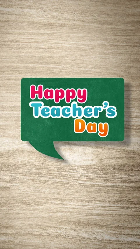 Animated Happy Teachers Day text inside a speech bubble on a wooden background Stock Footage 342552522