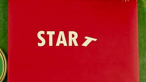 Animated letters appear on a bright red book cover to form the word Startup Stock Footage 340525662