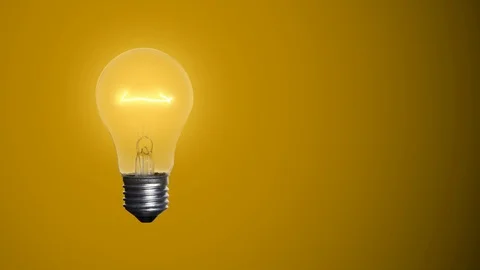 Animated light bulb on a yellow backgrou... | Stock Video | Pond5