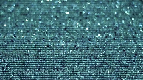Animated lines of text or program code move across a shiny, sparkling surface Stock Footage 313148837
