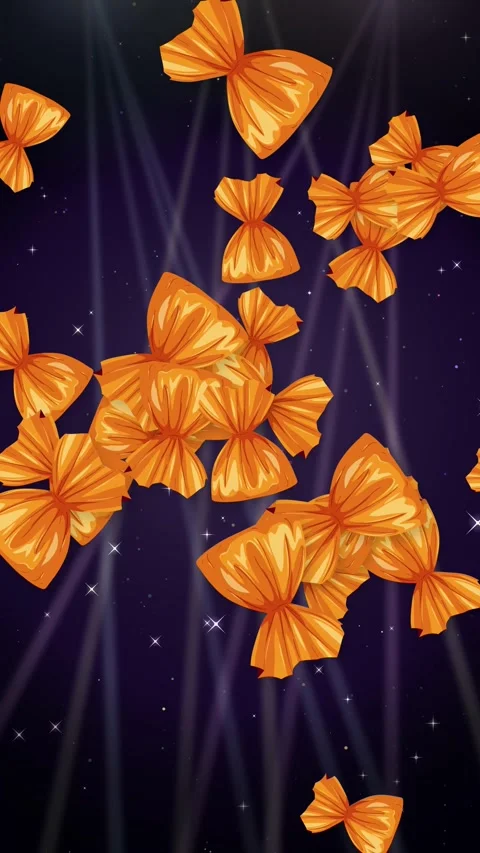 Animated Orange Wrapped Candies Falling Over Dark Glitter Background Stock Footage 345206555