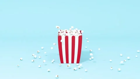 Animated popcorn box with kernels popping out, dynamic motion on light blue.. Stock Footage 332382910
