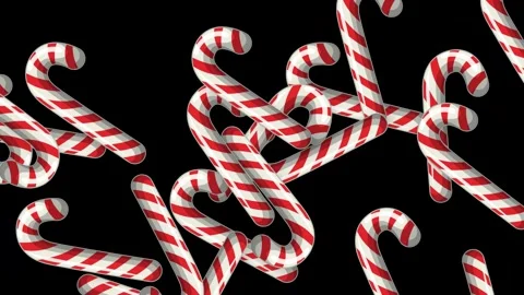 Animated Red and White Candy Canes Falling Against Black Background Stock Footage 343819103