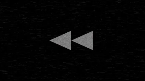 Animated rewind button on a black background with retro distortion Stock Footage 333815991