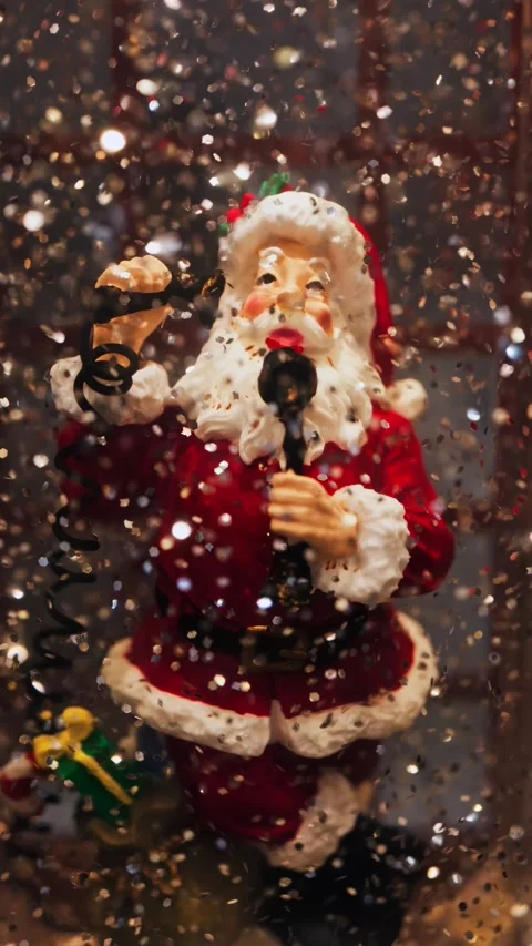 Animated santa claus figure inside snow globe with swirling glitter effect .. Stock Footage 339373680