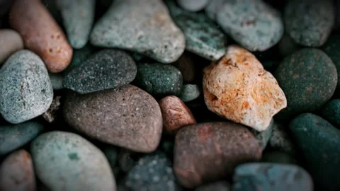An animated sequence of multiple stills showcases beautiful, colorful stones on  動画素材 255410543