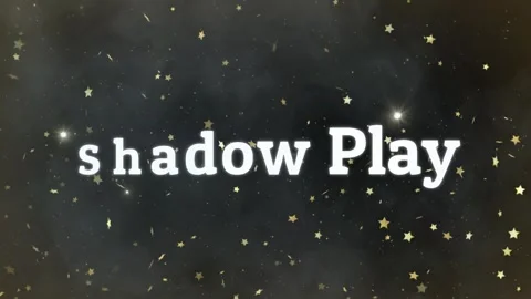 Animated shadow play text reveal with floating golden star particles on dark Stock Footage 338389748