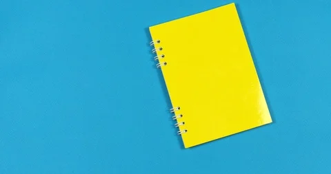 Animated stop motion. A notebook opens to him ballpoint pens crawl. Stock Footage 122767527