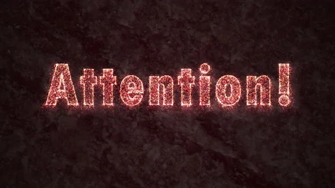 Animated text ATTENTION made of particles on a dark background 動画素材 196073080