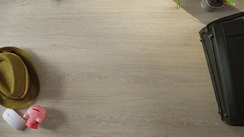 Animated things quickly filling suitcase, bag leaving room, top view stop-motion Stock Footage