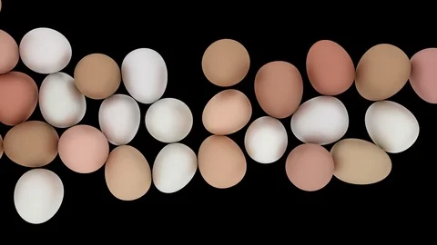Animated top view of rolling left to right mix of many white and regular eggs Stock Footage 104564577