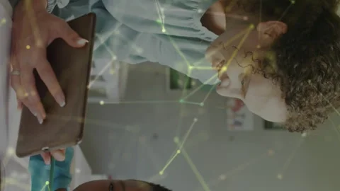 Animated video shows tech-savvy teacher and student interacting in a classroom. Stock Footage 313330742
