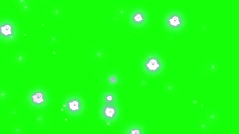 Animated white glowing ghost shapes floating across vibrant green screen Video stock 345329888
