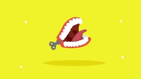 Animated wind up chattering teeth toy jumping on yellow background with spa.. Stock Footage 339069085