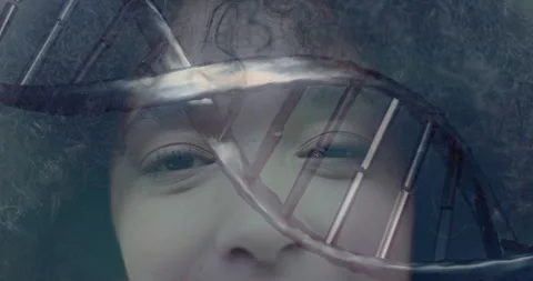 Animating DNA strand over close-up of person face, showing genetic connection Video stock 303461442