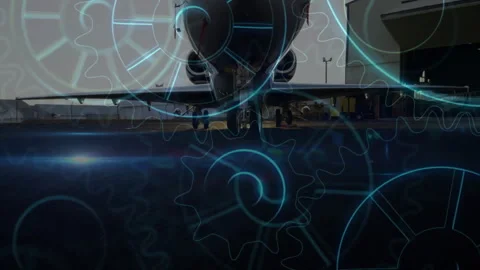 Animating gears and cogs over airplane maintenance scene at hangar Stock Footage 303685171