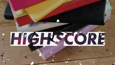 Animating HIGH SCORE overlay dissolving into shards above notebook stack on Stock Footage 331161318