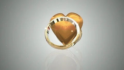 Animation 2 Rotating Wedding Rings Resting on Gold Heart Vidéo 118387357